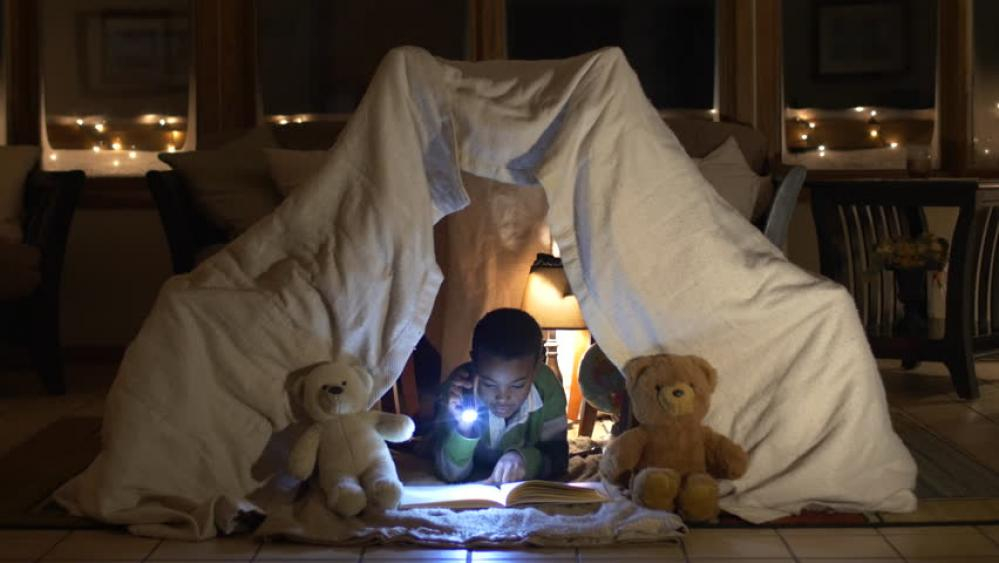 boy in blanket fort