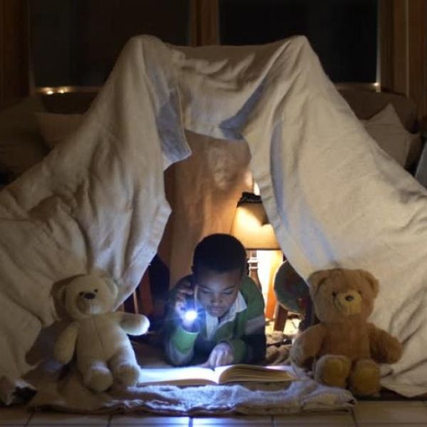 boy in blanket fort