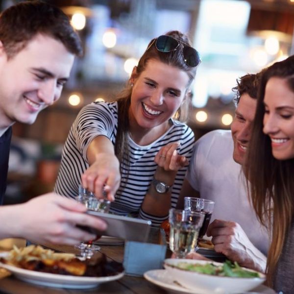 adults at restaurant as