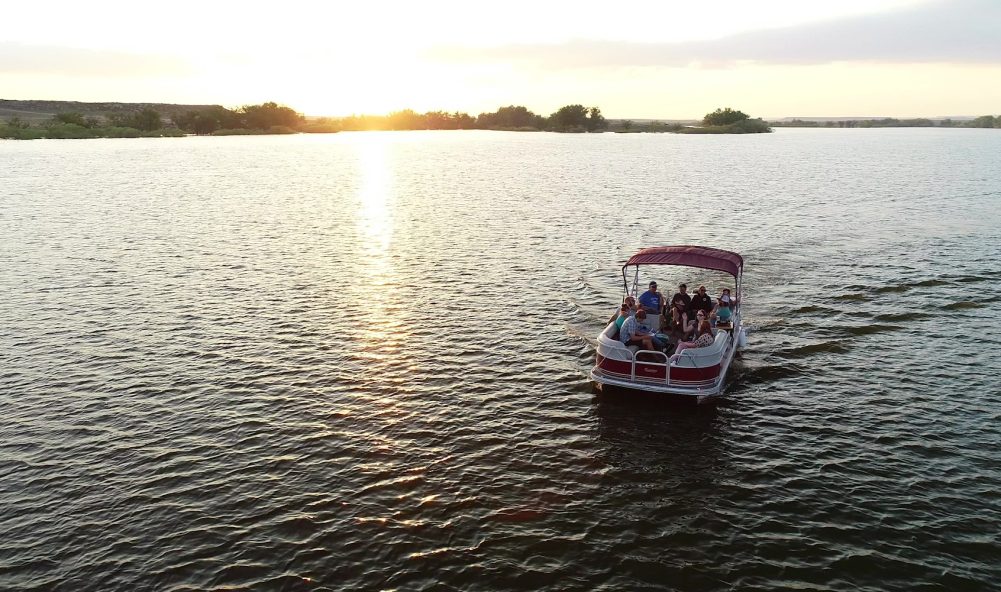 a group of people on a boat in the water